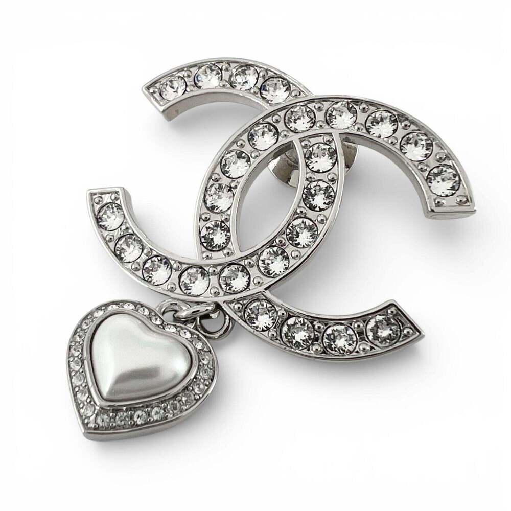 CHANEL Silver Logo Brooch
